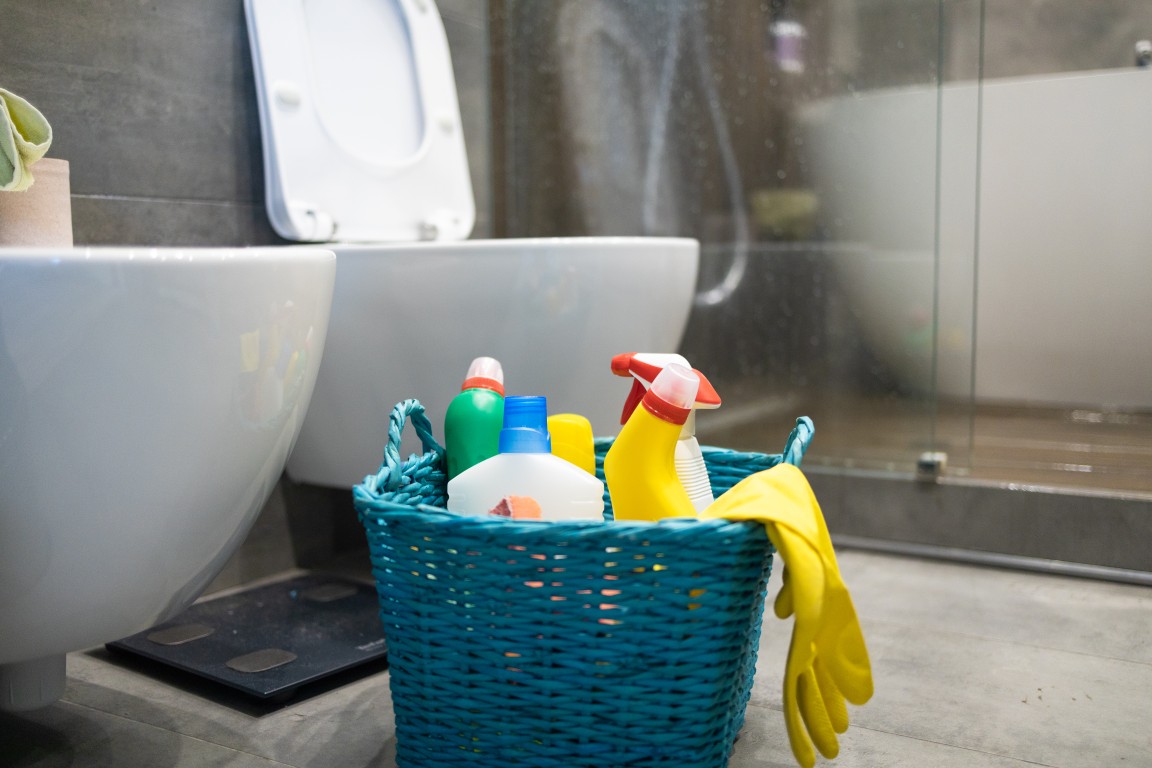 cleaning supplies in a bathroom | Featured image of the Best way to clean a bathroom blog